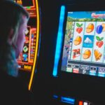 man playing slot machine game